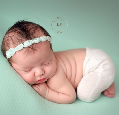 lapeer_baby_girl_teal_backdrop_newborn_photographer
