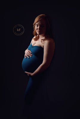 lapeer_maternity_photographer_studio_session_black_background_teal_chicaboo_dress