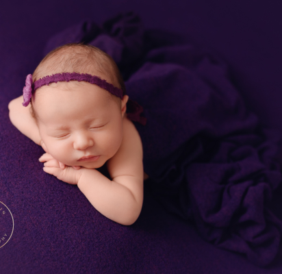 kat_fantin_photography_lapeer_michigan_newborn_studio_purple_pose
